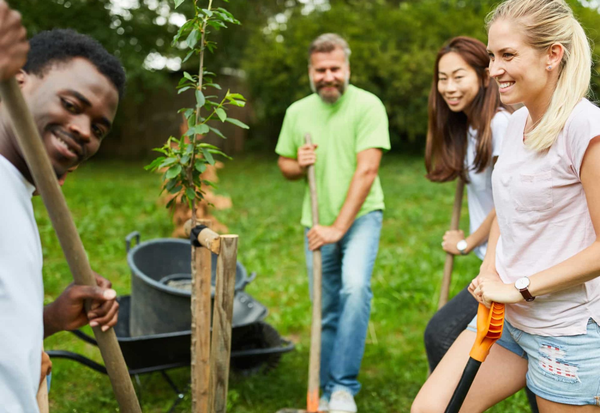 shutterstockteam-volunteer-plants-tree-together-park_1440961073 shutterstockteam-volunteer-plants-tree-together-park_1440961073